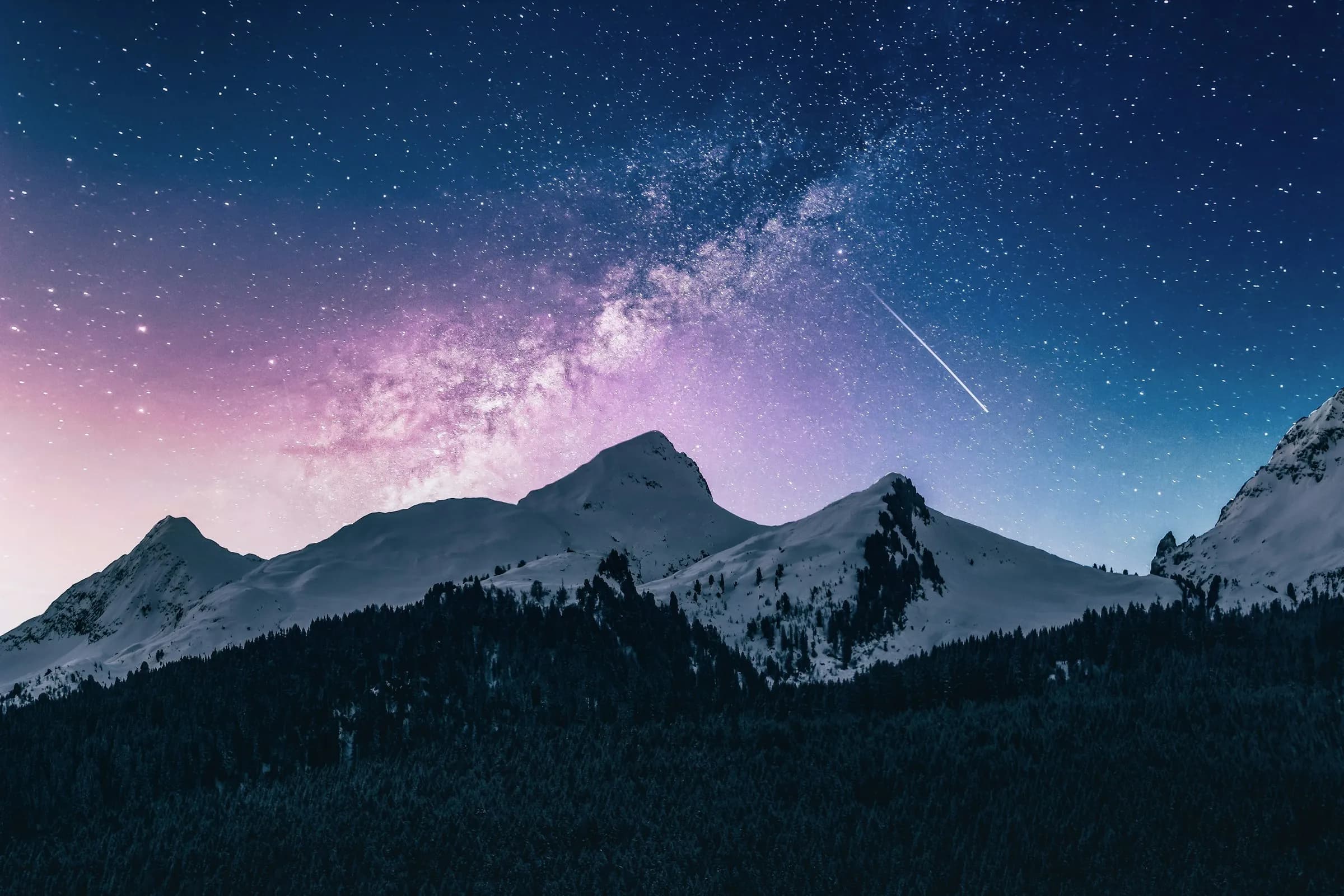 A snowy mountain under the stars